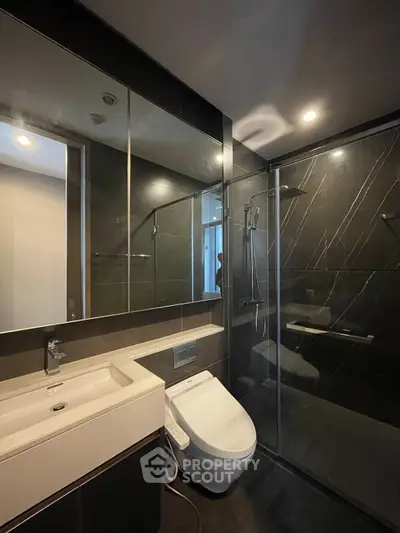 Modern bathroom with sleek design and glass shower enclosure