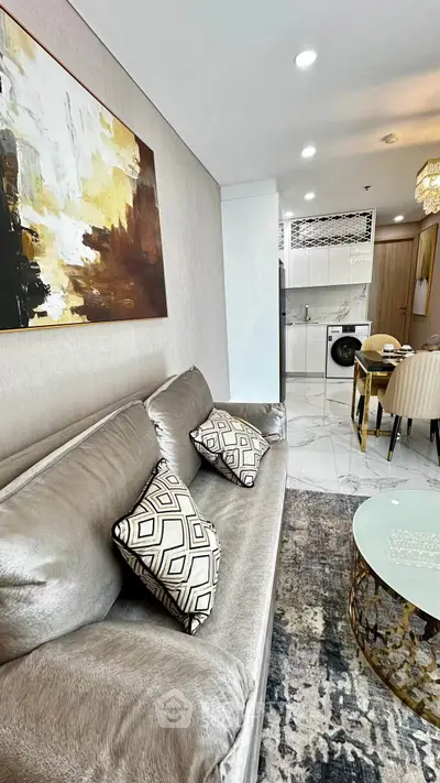 Luxurious modern living room with elegant decor and open kitchen layout