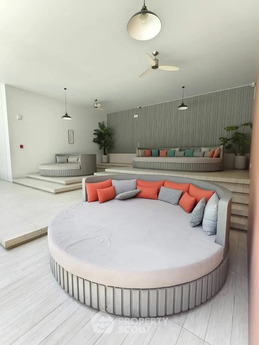 Luxurious modern lounge area with stylish round seating and elegant decor