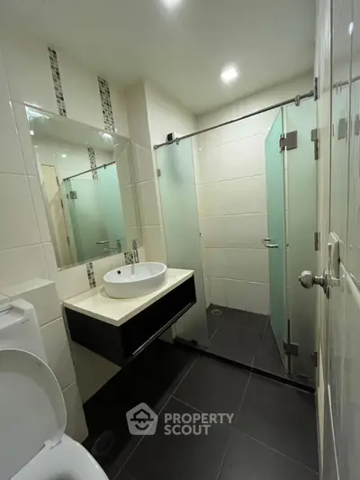 Modern bathroom with sleek design and glass shower enclosure