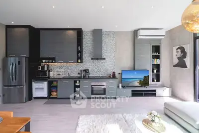 Modern open-layout kitchen with sleek appliances and stylish decor