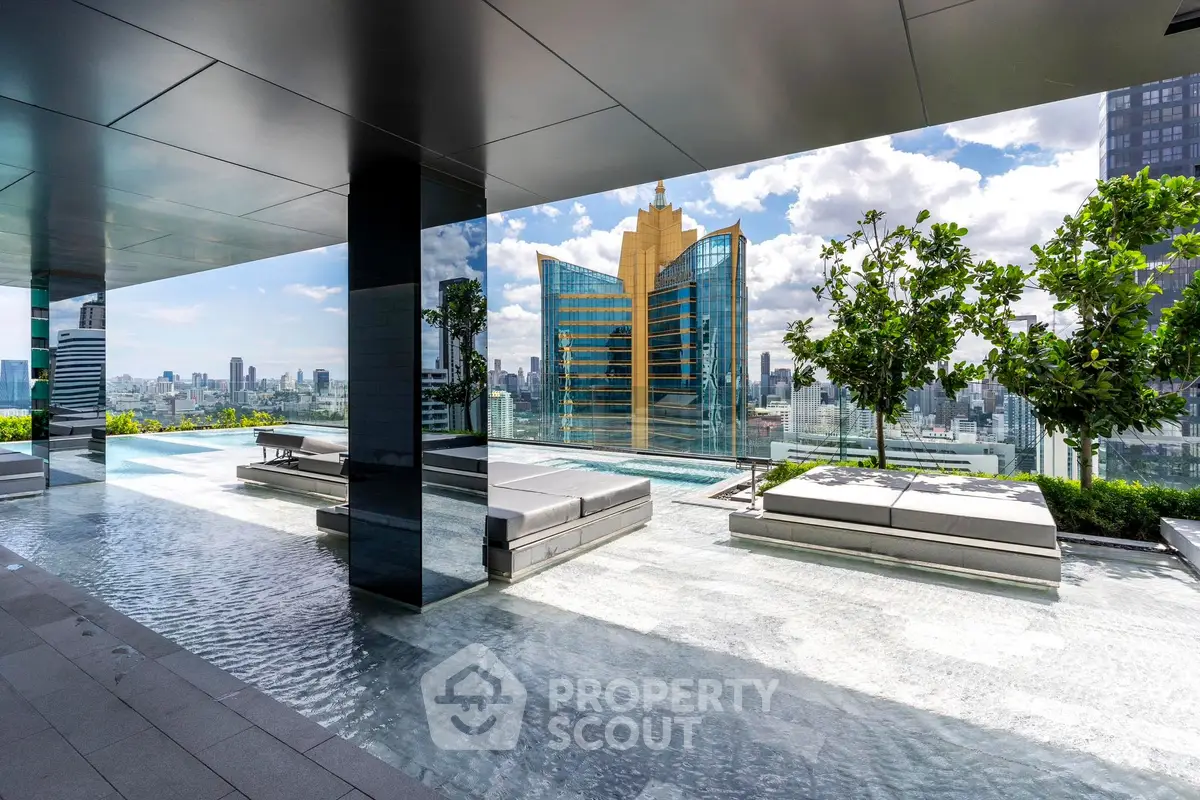Luxurious rooftop pool with stunning city skyline views and modern lounge seating.
