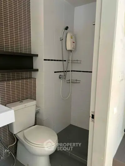 Compact bathroom with modern shower and toilet in sleek design