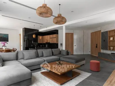 Spacious modern living room with stylish decor and open kitchen layout