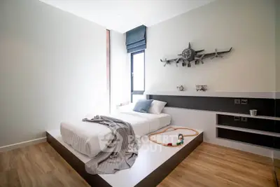 Modern minimalist bedroom with sleek design and wooden flooring