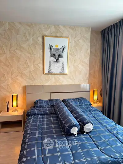 Modern bedroom with stylish decor and cozy bedding in a contemporary apartment.