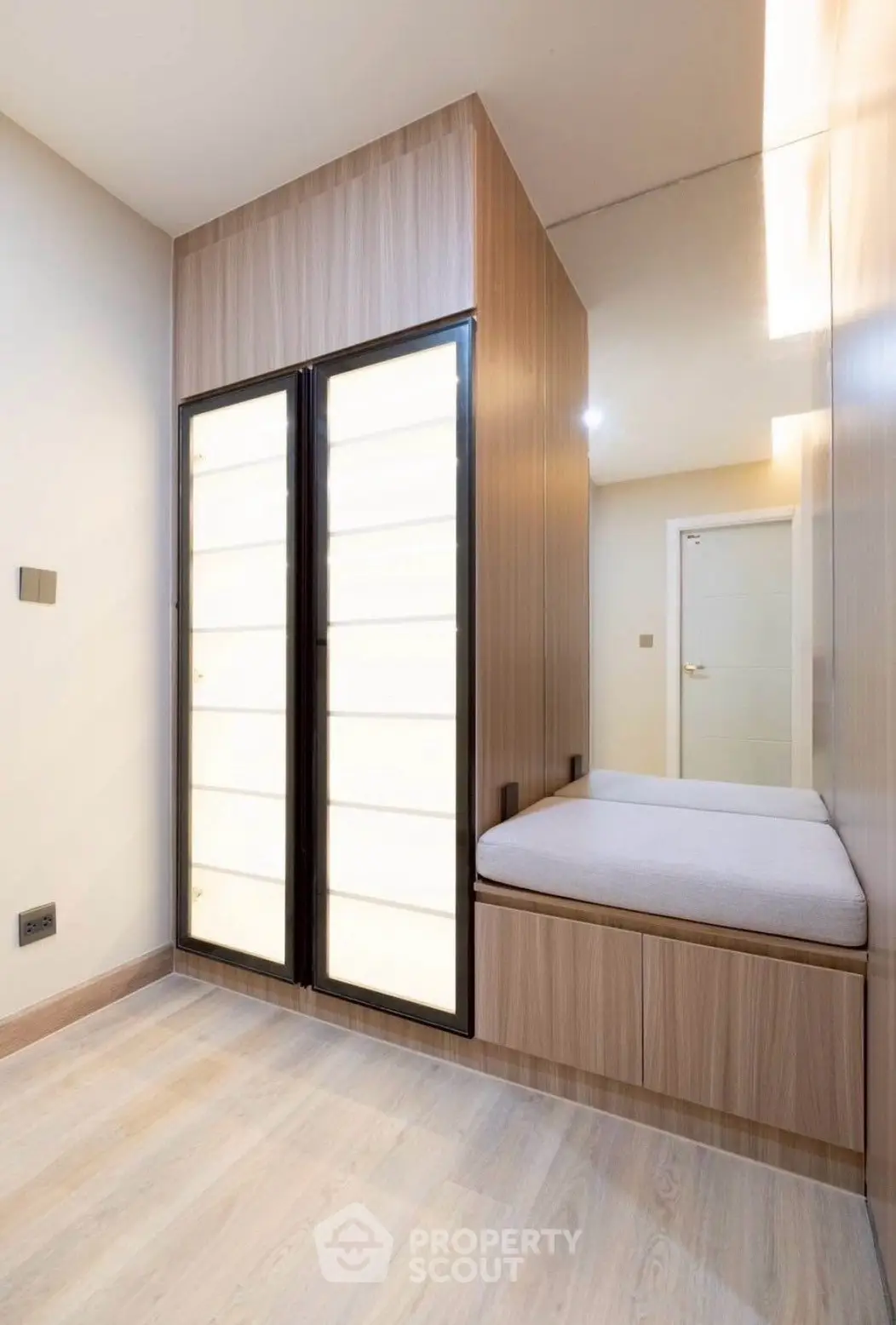Modern minimalist interior with wooden accents and built-in seating