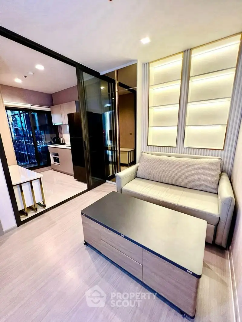 Modern living room with sleek design and open kitchen layout