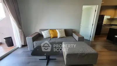Modern living room with stylish sofa and open kitchen layout