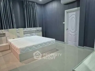 Modern bedroom with sleek design and elegant furnishings