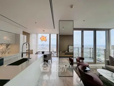 Luxurious open-plan living room with stunning city view and modern kitchen design.