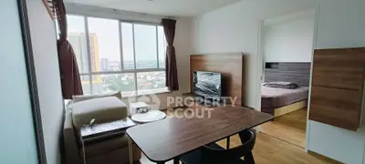 Modern apartment living room with city view and cozy bedroom