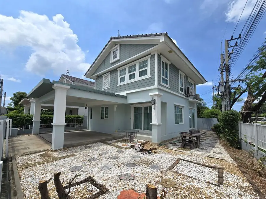 Charming two-story house with spacious yard and modern exterior design