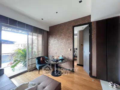 Stylish living room with balcony access and modern decor