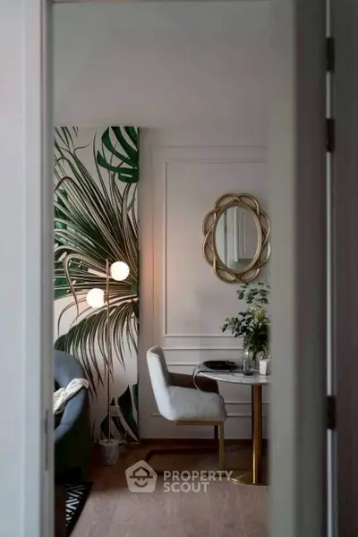 Chic modern living room with stylish decor and tropical wallpaper