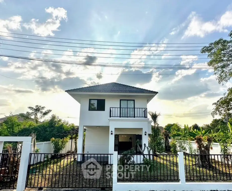 Charming two-story house with lush garden and scenic sky view