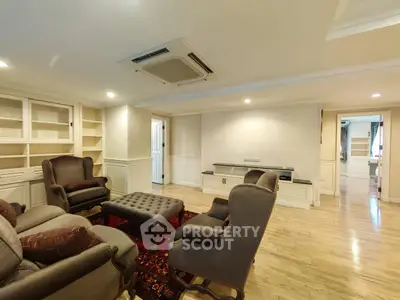 Spacious living room with elegant furniture and built-in shelves