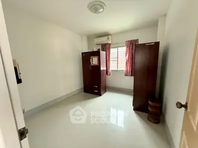 Spacious unfurnished bedroom with natural light and air conditioning