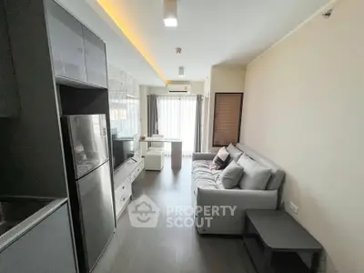 Modern living room with sleek design and natural light, featuring a cozy sofa and stylish decor.