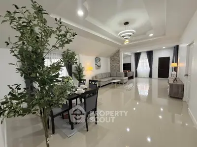 Spacious modern living room with elegant dining area and stylish decor