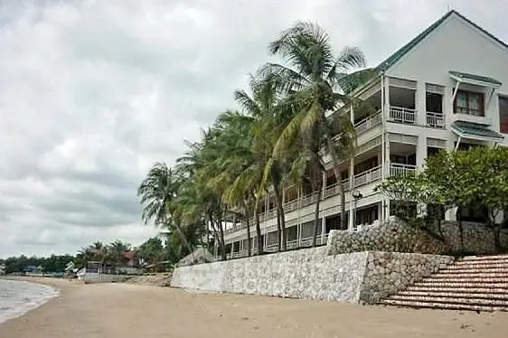 Beachfront property with palm trees and stunning ocean view