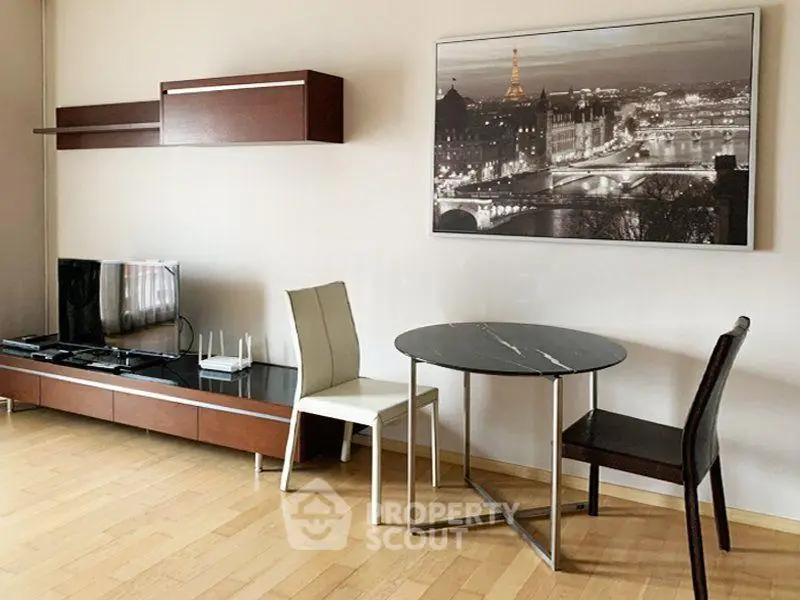Stylish living room with modern furniture and elegant wall art, perfect for urban living.
