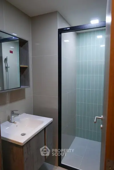Modern bathroom with sleek design and glass shower enclosure