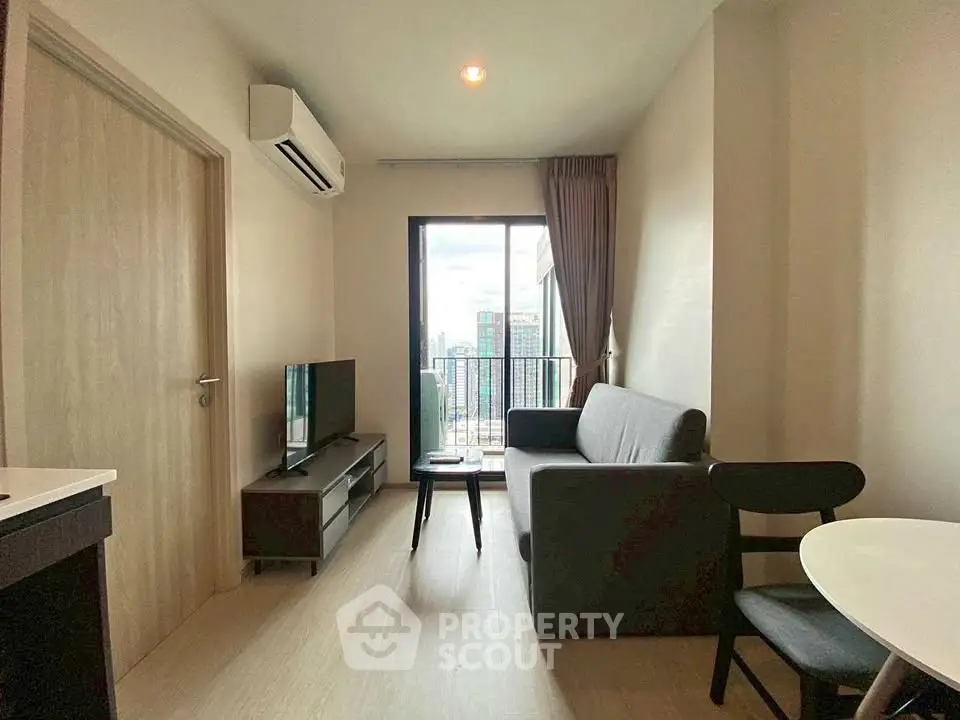 Modern living room with balcony view in high-rise apartment