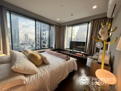 Luxurious bedroom with stunning city view and modern amenities