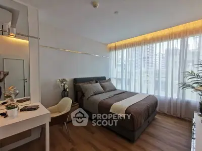 Modern bedroom with large windows and stylish decor in urban apartment