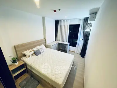 Modern bedroom with cozy decor and ample natural light