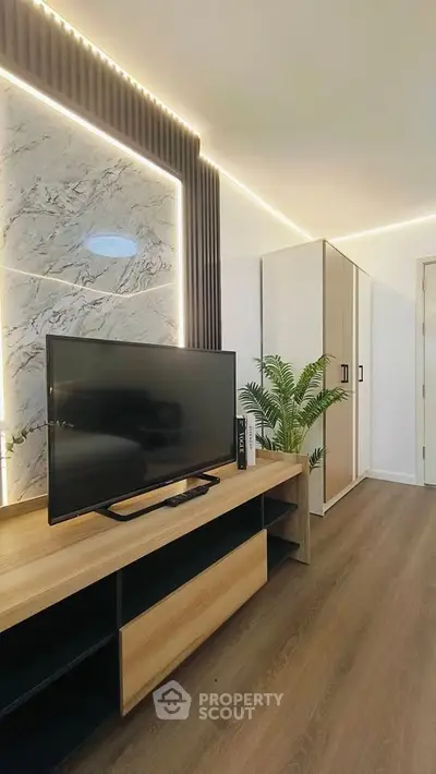 Modern living room with stylish TV unit and elegant decor