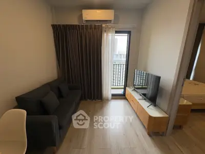 Modern living room with balcony access and sleek furniture