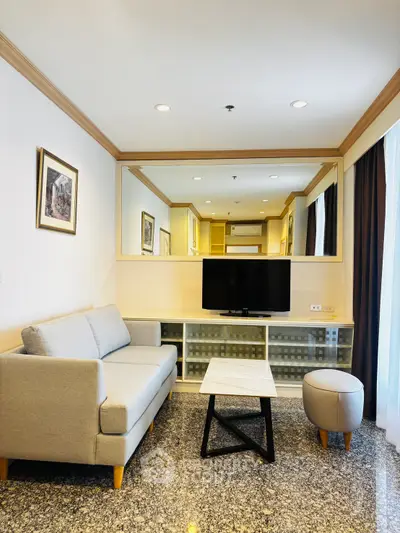 Modern living room with stylish furniture and large mirror