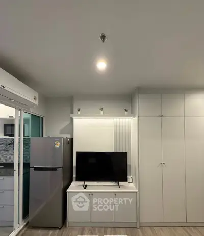 Modern living room with sleek TV setup and stylish storage solutions