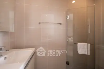 Modern bathroom with glass shower and sleek sink design