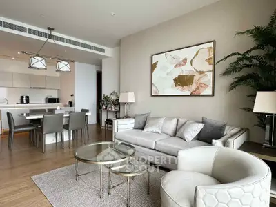 Luxurious open-plan living room with elegant decor and modern kitchen