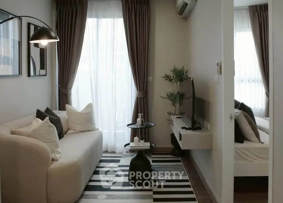 Chic modern living room with cozy sofa, stylish decor, and natural light, perfect for urban living.