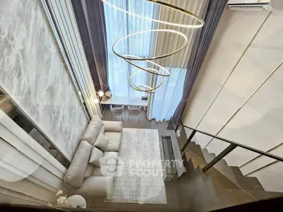 Luxurious modern living room with high ceiling and elegant lighting