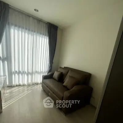 Cozy living room with natural light and modern sofa