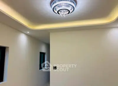 Elegant interior with modern ceiling design and stylish lighting fixture.