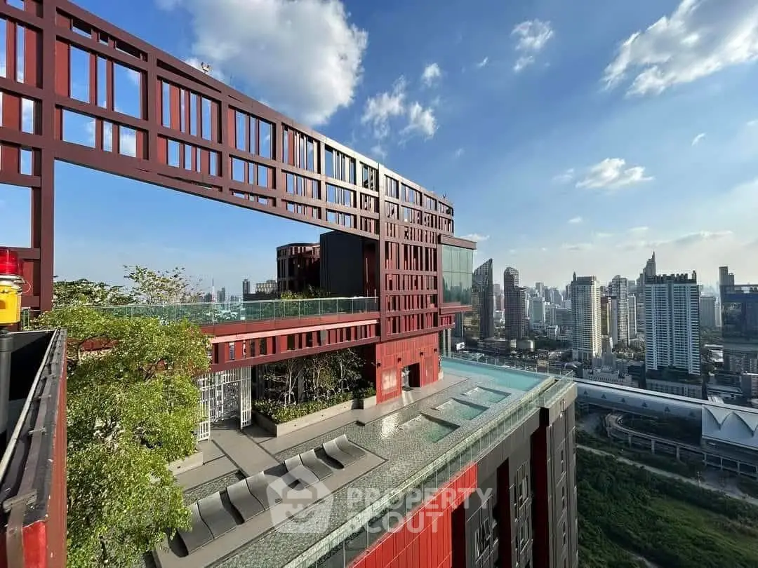 Stunning rooftop pool with panoramic city views in a modern high-rise building.
