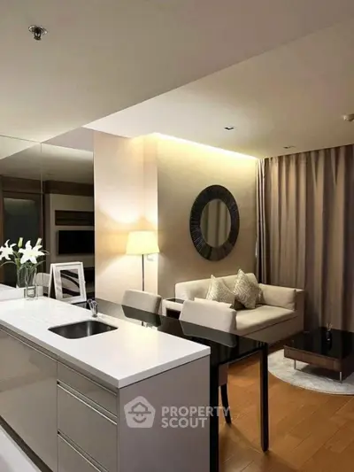 Modern open-plan living room with elegant decor and cozy seating area