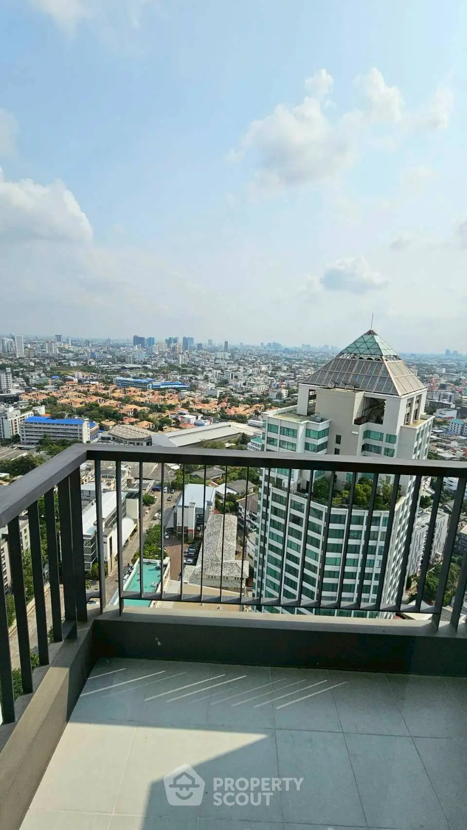 Stunning cityscape view from a high-rise balcony, perfect for urban living enthusiasts.