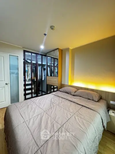 Modern bedroom with cozy lighting and walk-in closet