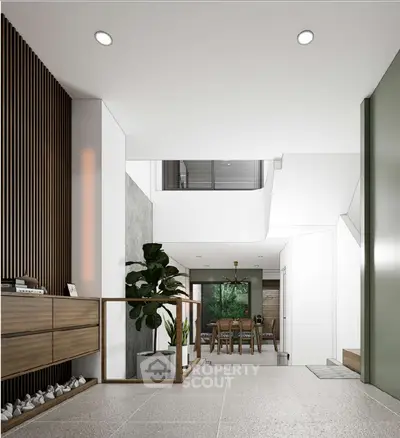 Modern open-plan living area with stylish decor and natural light