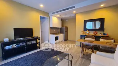 Modern living room with open kitchen and stylish decor