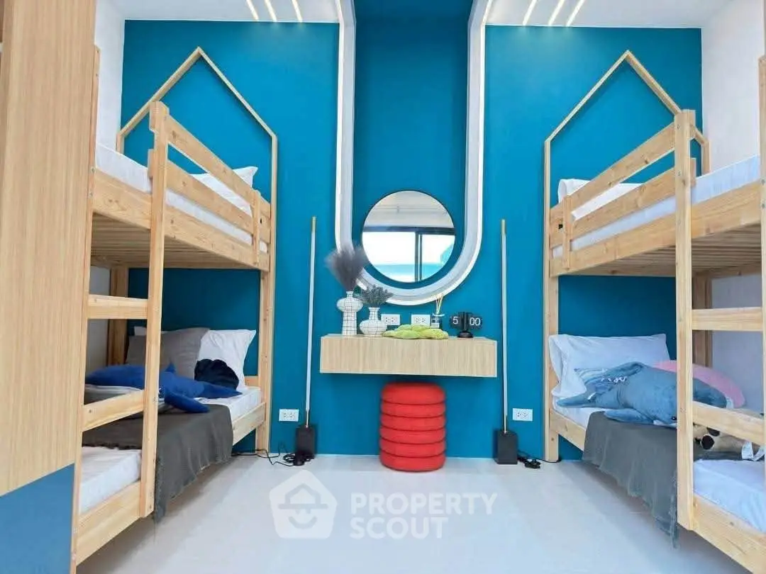 Modern bedroom with bunk beds and stylish decor, perfect for maximizing space and comfort.