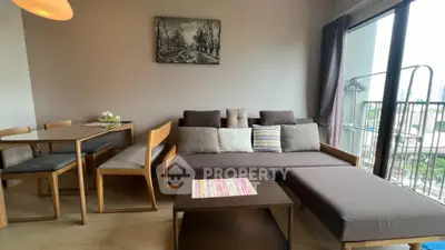 Modern living room with stylish furniture and city view balcony