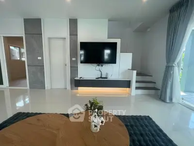 Modern living room with sleek TV setup and elegant decor